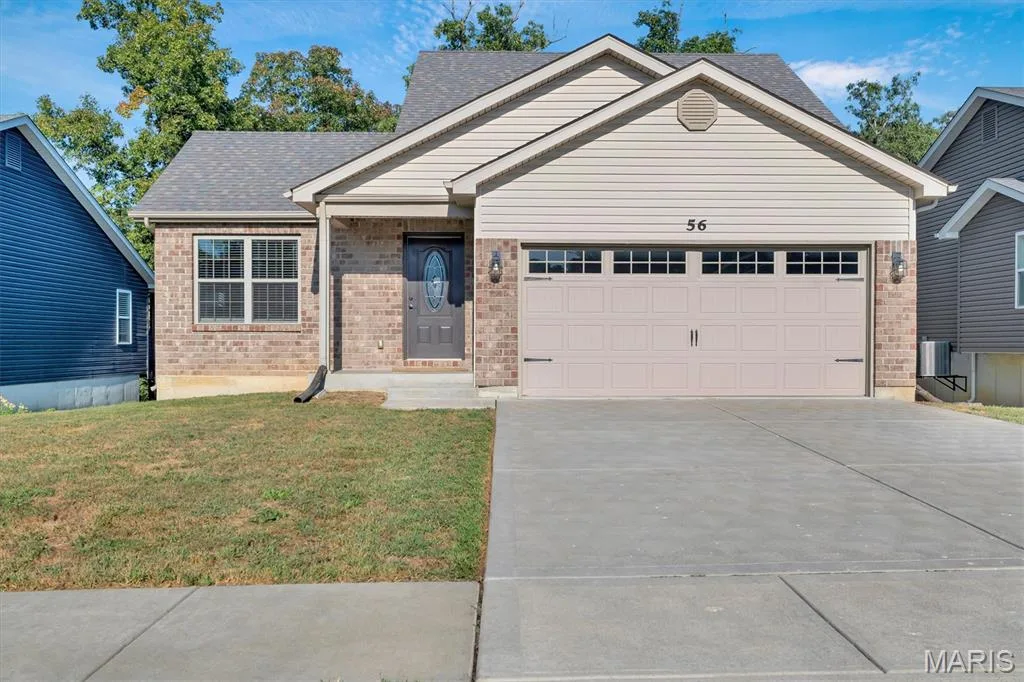 Brick and siding facade with a two-car garage — 56 Huntleigh Park Court, Wentzville, MO 63385