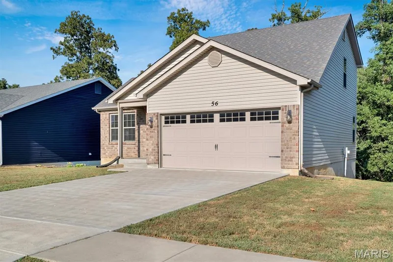 Brick veneer and siding exterior with an attached garage — 56 Huntleigh Park Court, Wentzville, MO 63385