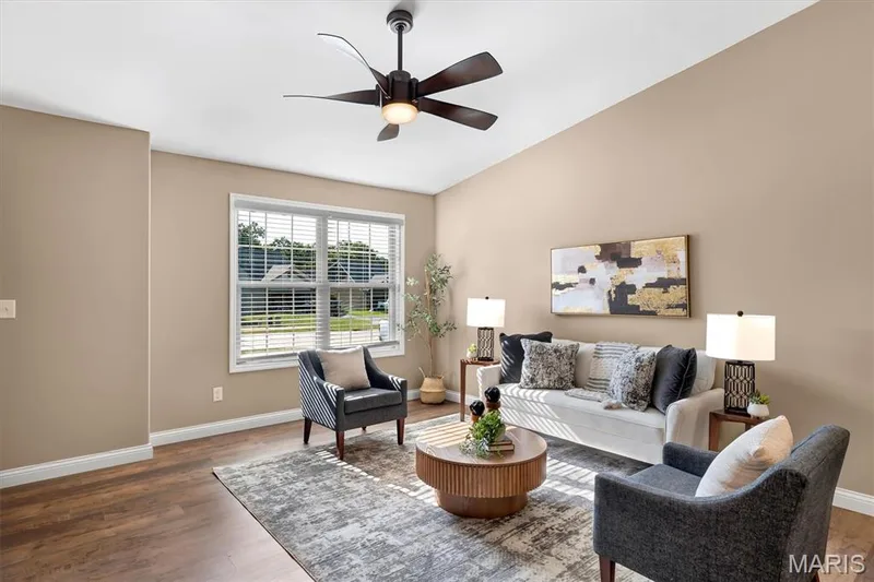 Vaulted ceiling, ceiling fan with integrated lighting, window with blinds, wood-finish flooring, and recessed lighting — 56 Huntleigh Park Court, Wentzville, MO 63385