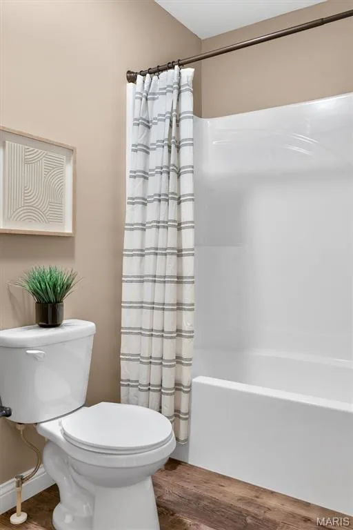 White bathtub-shower combination with a bronze-finish shower rod — 56 Huntleigh Park Court, Wentzville, MO 63385