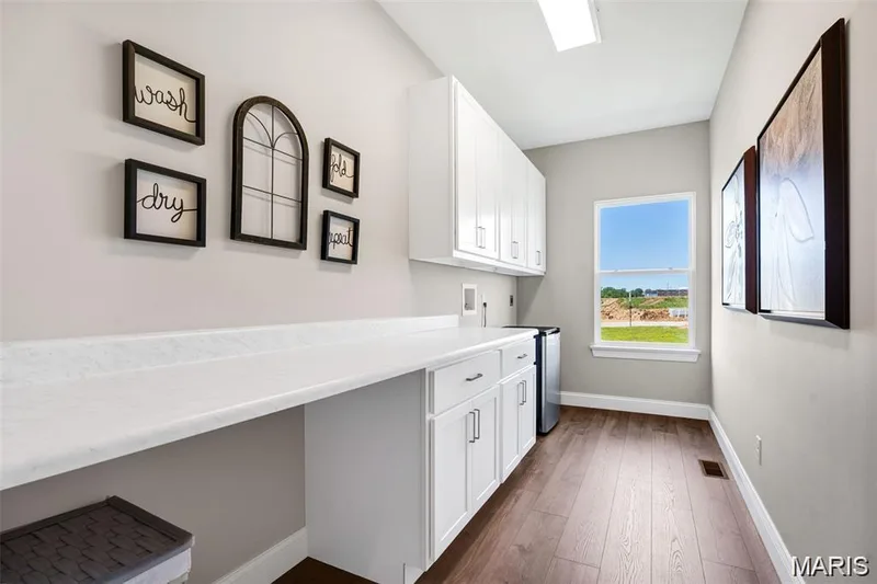 Laundry room.  Photo from a previously completed home. — 1 Grand Columbia, O'Fallon, MO 63366