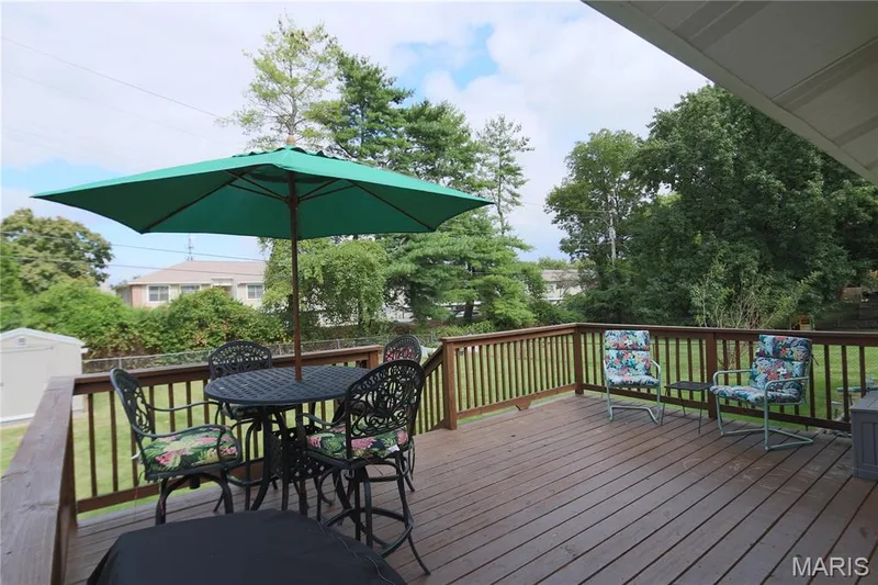Expansive wood deck with a full railing system. Just waiting for you fall outside parties. Bring on the BBQ. — 3 Oxbow Road, St Peters, MO 63376