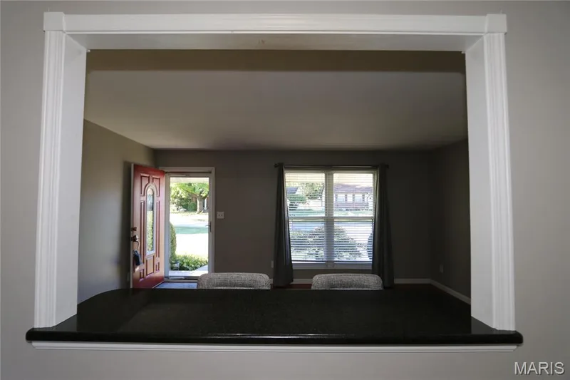 View from other side of pass-through from kitchen into family room. — 3 Oxbow Road, St Peters, MO 63376