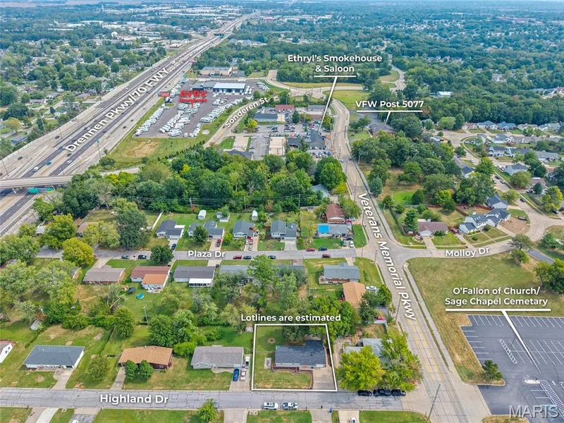 Residential property with surrounding green spaces and established neighborhood streets — 712 Highland Drive, O'Fallon, MO 63366