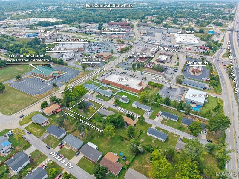 Aerial perspective highlighting proximity to Highway K, Veterans Memorial Parkway, and Drennen Pkwy/70 FWY — 712 Highland Drive, O'Fallon, MO 63366