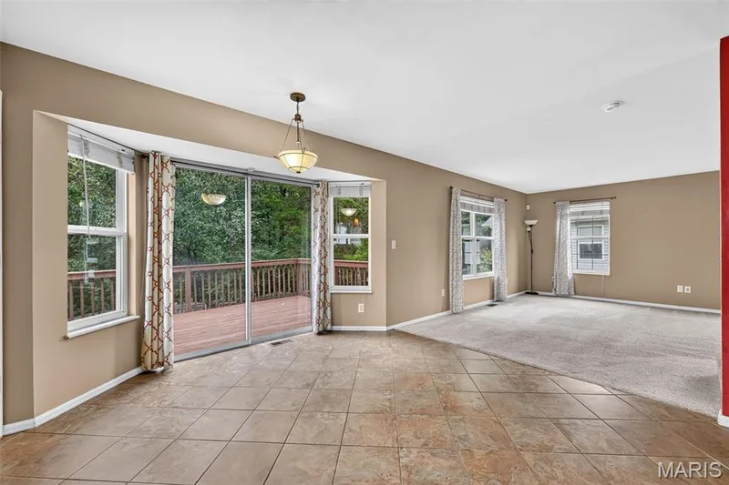 The bay window overlooking trees gives so much space for your kitchen table! — 1033 Providence Pointe Drive, Wentzville, MO 63385
