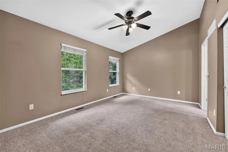 Two windows in the primary bedroom allow plenty of light in. — 1033 Providence Pointe Drive, Wentzville, MO 63385
