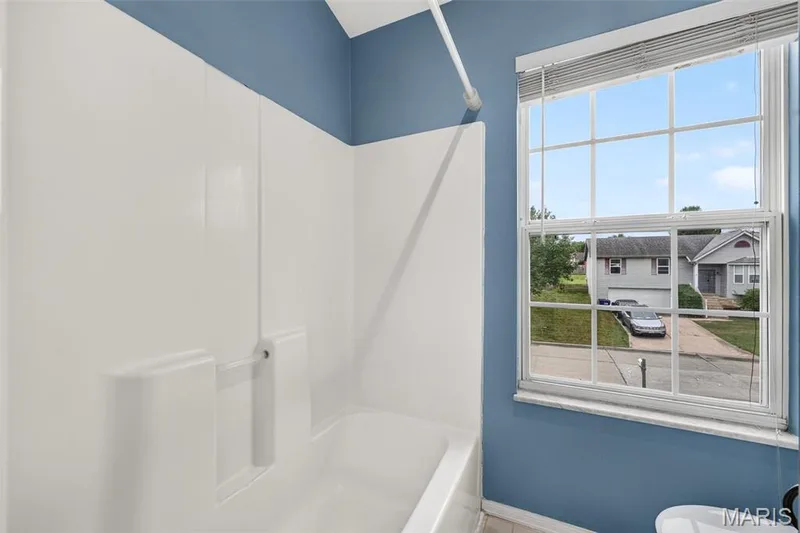 A window in the primary bathroom makes getting ready a breeze. — 1033 Providence Pointe Drive, Wentzville, MO 63385
