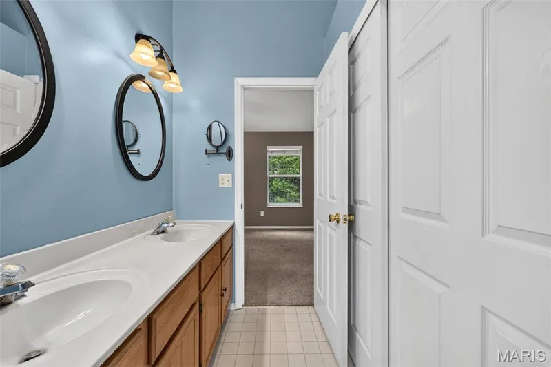 View from the attached bathroom into the primary bedroom. — 1033 Providence Pointe Drive, Wentzville, MO 63385