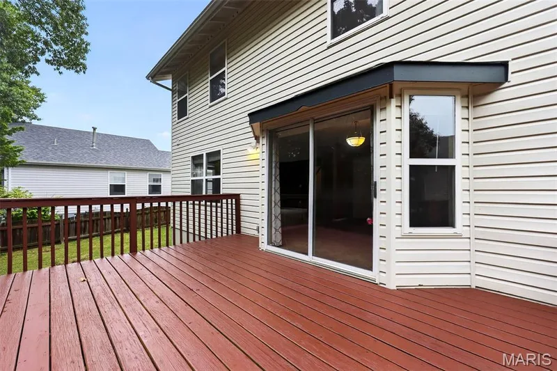 Plenty of room on this deck for your outdoor furniture. Easy access back to the kitchen for all of your grilling! — 1033 Providence Pointe Drive, Wentzville, MO 63385