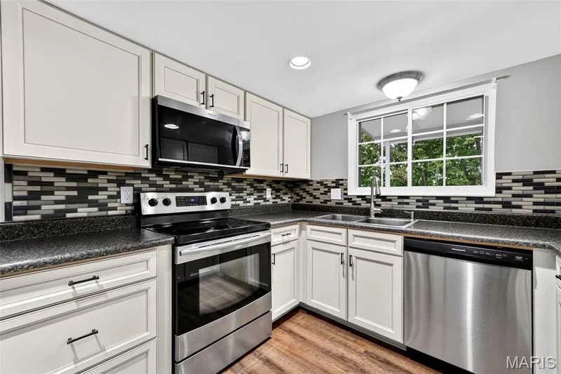 Stainless appliances & tile backsplash — 2972 Wheatfield Farms Drive, O'Fallon, MO 63368