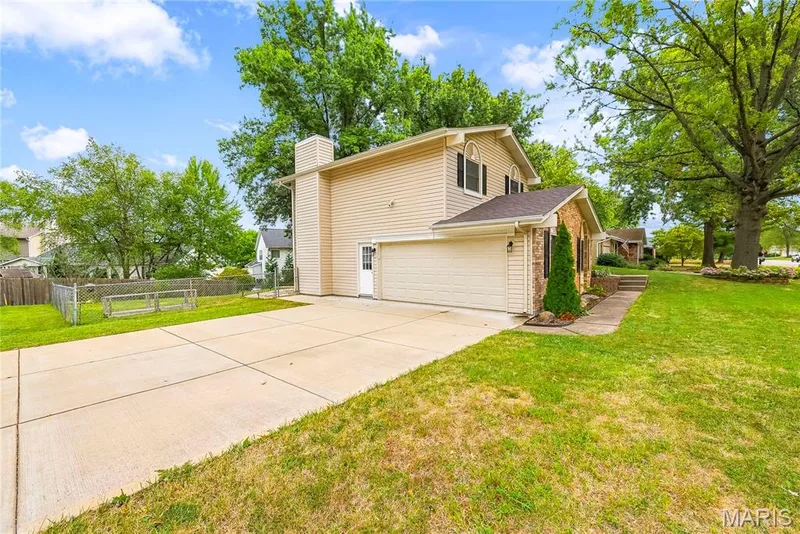 Half Glass Door leads to the EXTRA DEEP Drywalled & Insulated Garage! — 27 Oak Valley Drive, St Peters, MO 63376