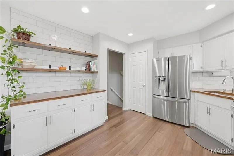 Charming & Designer Kitchen with Pantry, Butcher Block Counters, Open Shelving & White Subway Tile Backsplash! — 27 Oak Valley Drive, St Peters, MO 63376