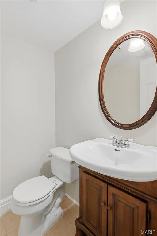 Half Bath with Tile Floor, Elongated Toilet, Designer Sink, Mirror & Lighting! — 27 Oak Valley Drive, St Peters, MO 63376