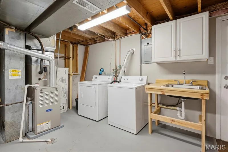 Laundry Room with Utility Sink & Cabinetry! Dryer stays! — 27 Oak Valley Drive, St Peters, MO 63376