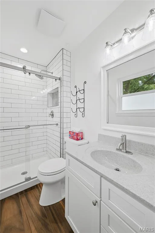Owners Bath features Luxury Vinyl Wood Plank Floors, Designer White Subway Tile with Merchandise Shelf, Rain Shower Head & Designer Glass Doors! Tall Designer Vanity & Toilet & Operational Window too! — 27 Oak Valley Drive, St Peters, MO 63376