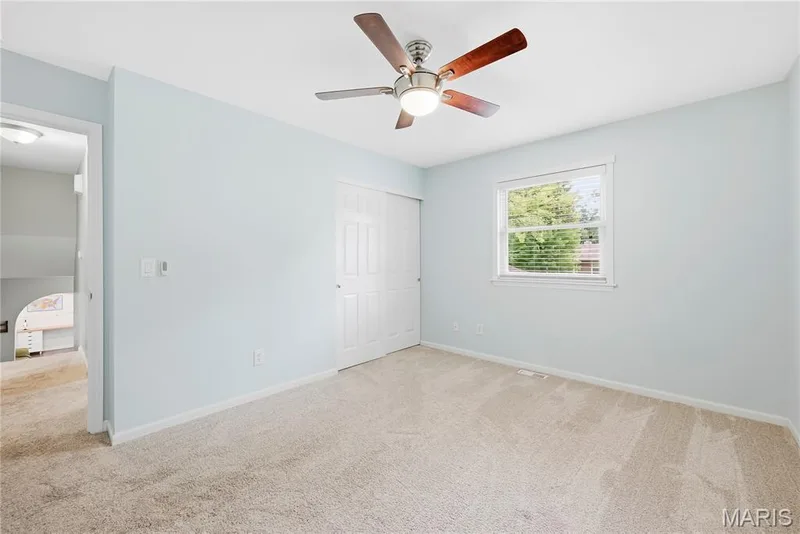 Bedroom #2 features a Full-Size Closet & Ceiling Fan with Light! — 27 Oak Valley Drive, St Peters, MO 63376