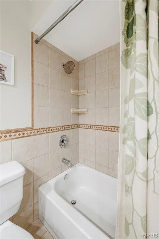 Designer Tile highlights the Tub/Shower with Shelving! There is even a Linen Closet! — 27 Oak Valley Drive, St Peters, MO 63376
