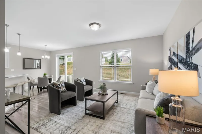 Light & bright open concept with breakfast bar for additional seating. — 17 Rydal Place, St Charles, MO 63303