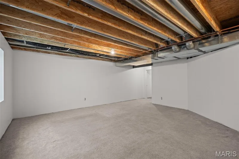 Expansive unfinished basement featuring exposed ceiling joists, — 17 Rydal Place, St Charles, MO 63303