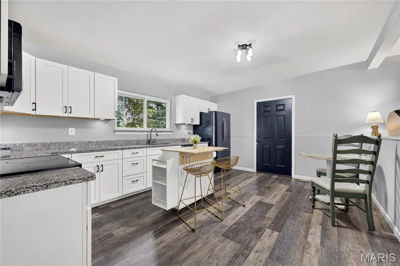 Kitchen with room for a dining table; the rolling island stays — 34 Highland Drive, St Charles, MO 63303