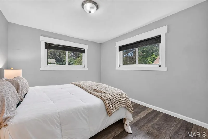 Bedroom with two windows and luxury vinyl flooring — 34 Highland Drive, St Charles, MO 63303