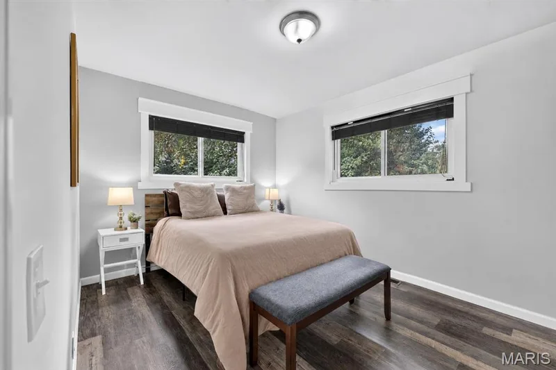 Bedroom with two windows and luxury vinyl flooring — 34 Highland Drive, St Charles, MO 63303