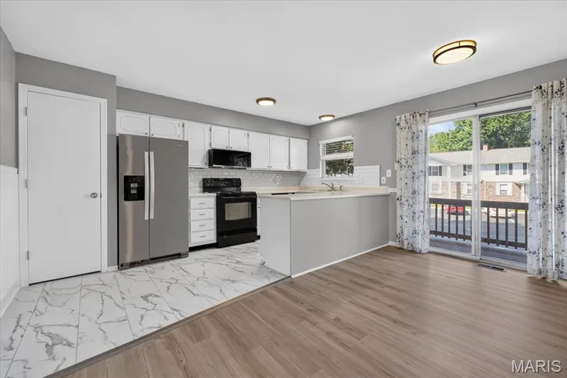 Breakfast area accesses the balcony — 885 Delray Drive #H, St Peters, MO 63376