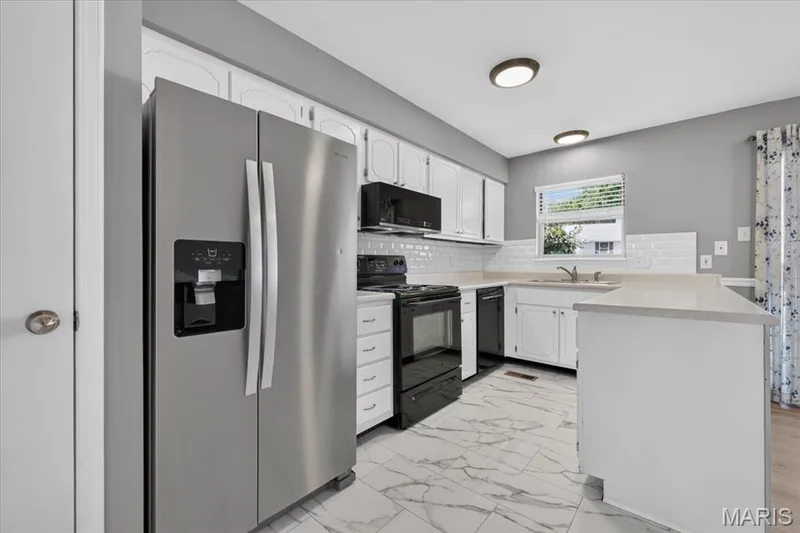 Galley style kitchen, w/updated appliances which are all included — 885 Delray Drive #H, St Peters, MO 63376