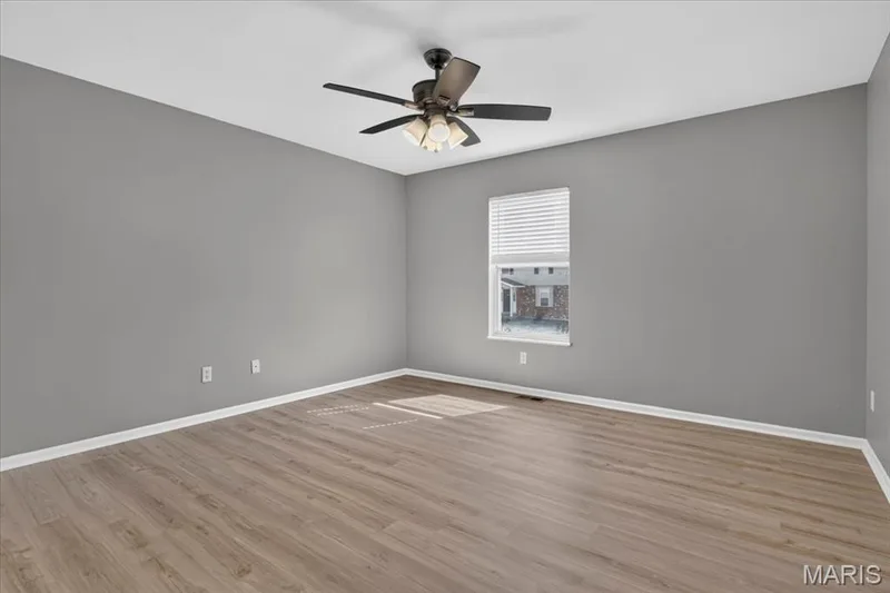 Primary bedroom w/lighted ceiling fan — 885 Delray Drive #H, St Peters, MO 63376