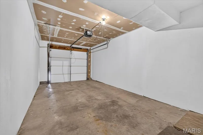 Garage w/opener enters the common basement right across from laundry area. — 885 Delray Drive #H, St Peters, MO 63376