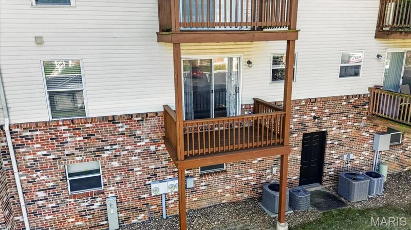 Exterior view of balcony accessed from breakfast area — 885 Delray Drive #H, St Peters, MO 63376