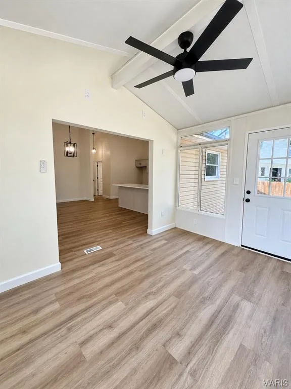 Wood-finish flooring throughout, vaulted ceiling, and a modern ceiling fan — 1731 Fairview Farms Circle, Wentzville, MO 63385