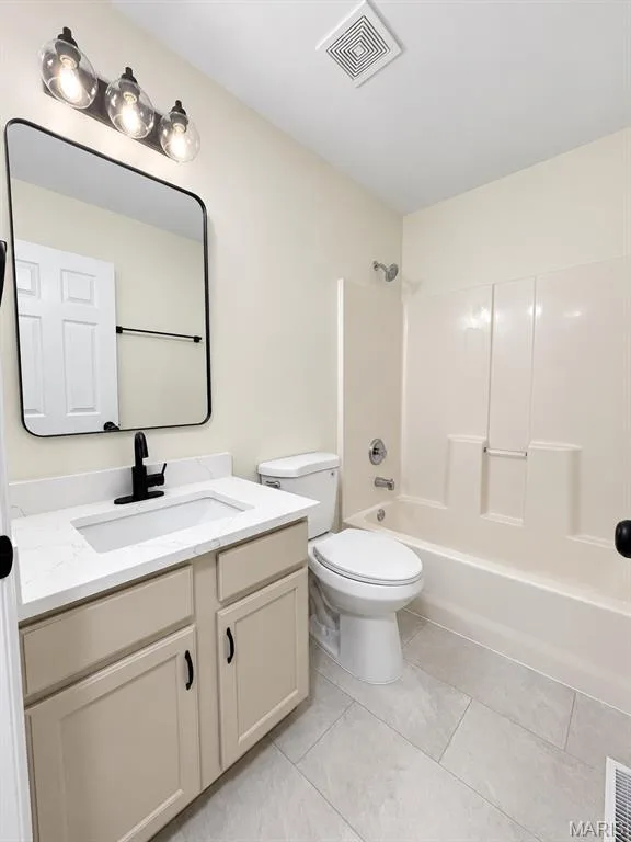 Bathroom with a single vanity, undermount sink, quartz countertop, and black-finish faucet — 1731 Fairview Farms Circle, Wentzville, MO 63385