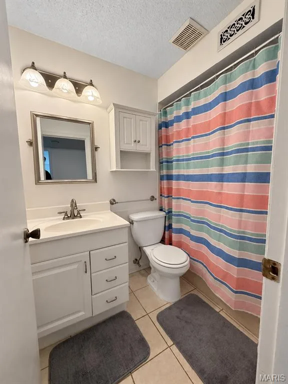 White vanity with integrated sink and chrome faucet — 15631 Hedgeford Court #9, Chesterfield, MO 63017