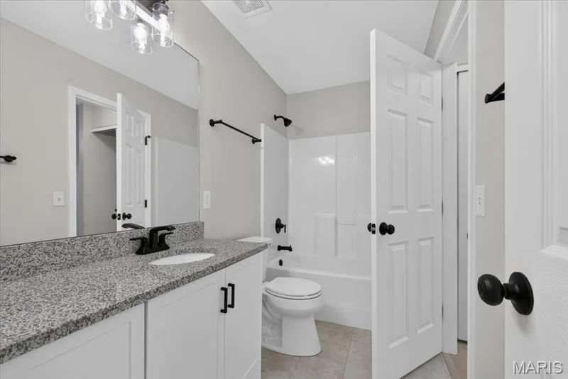 Updated Jack and Jill bath viewed from central hallway — 1540 Batters Box Drive, O'Fallon, MO 63366