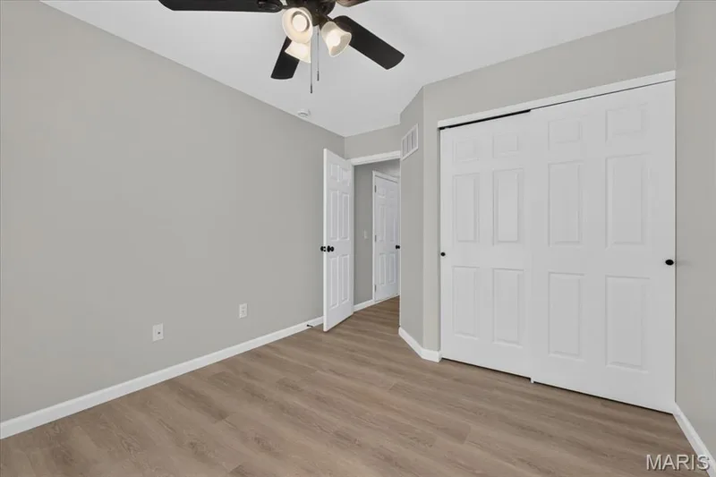 Second bedroom also features a double wide closet and lighted fan — 1540 Batters Box Drive, O'Fallon, MO 63366