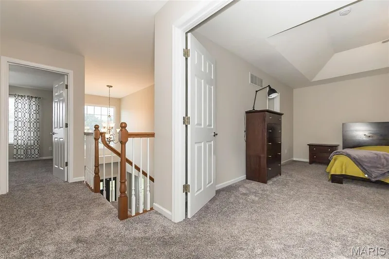 Upper landing with double doors to the Primary Bedroom — 472 Brookhaven Court, O'Fallon, MO 63368