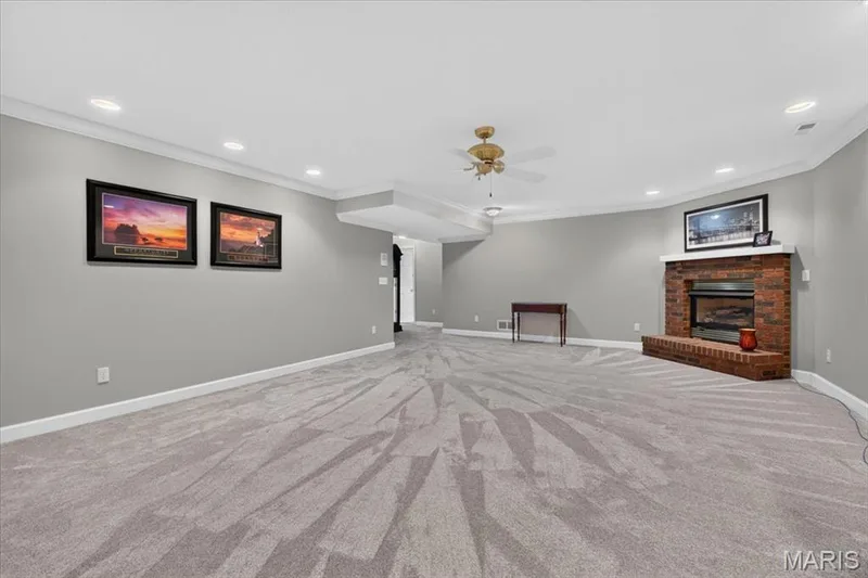 Lower level family room w fireplace — 2169 Farnsworth Drive #1424A, O'Fallon, MO 63368