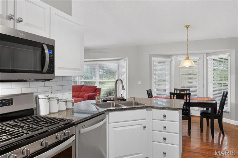 Kitchen opens to breakfast room — 2169 Farnsworth Drive #1424A, O'Fallon, MO 63368