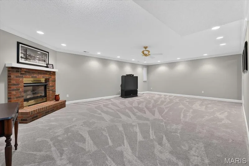 Large family room in basement w fireplace — 2169 Farnsworth Drive #1424A, O'Fallon, MO 63368