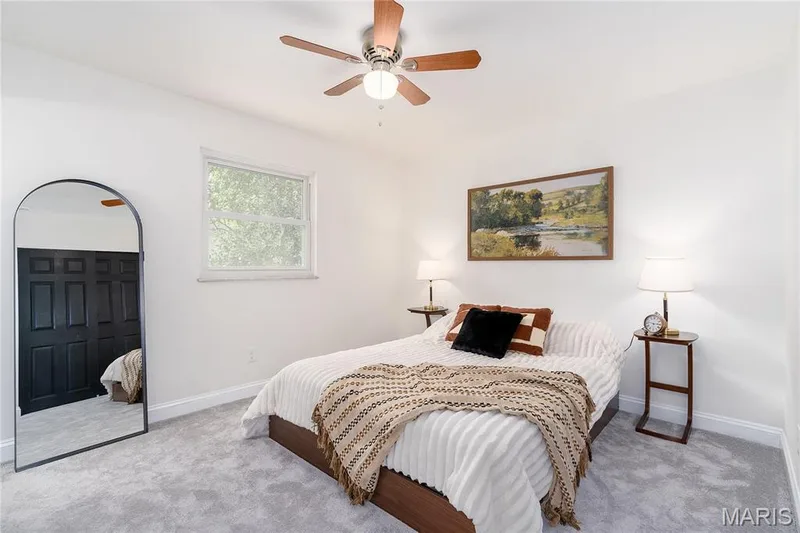 White walls with a single window, a ceiling fan with light, and light gray carpeting — 3025 Sherwood Lane, St Charles, MO 63301