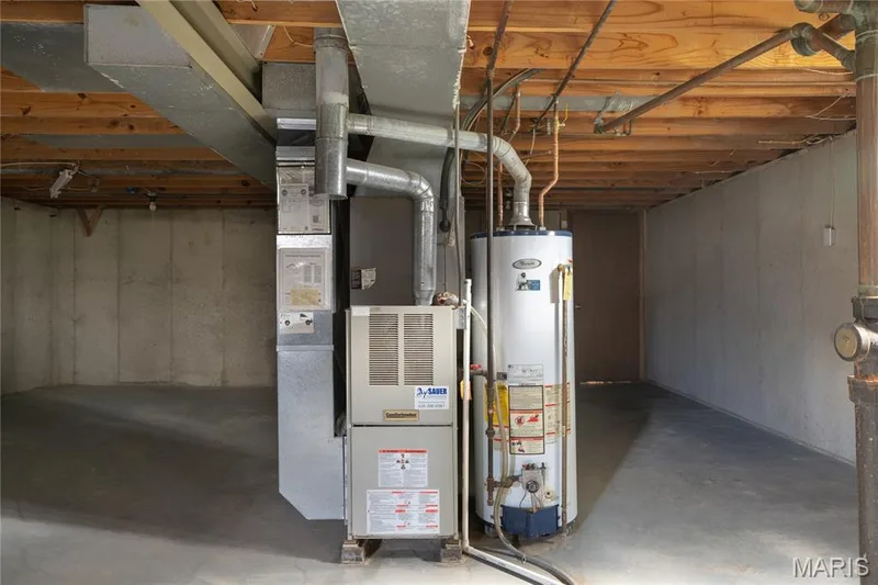 Unfinished basement with concrete flooring, exposed wood joists, and concrete foundation walls — 3025 Sherwood Lane, St Charles, MO 63301