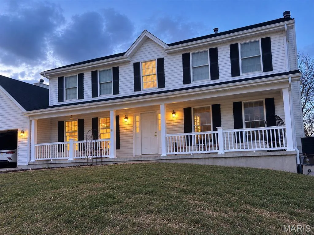 Two-story residence with white siding and a black shingle roof — 8 Jacobs Place Court, O'Fallon, MO 63376