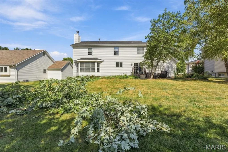 Two-story exterior with white siding, bay window, and a deck — 8 Jacobs Place Court, O'Fallon, MO 63376