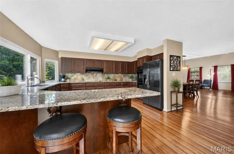 Large Kitchen With Backyard Views! Tons of Storage & Granite Countertops — 25 Vicksburg Station, St Charles, MO 63303