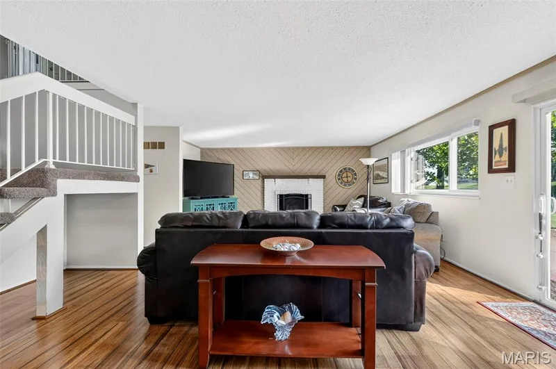 Back Family Room w/ Fireplace & Backyard Access — 25 Vicksburg Station, St Charles, MO 63303