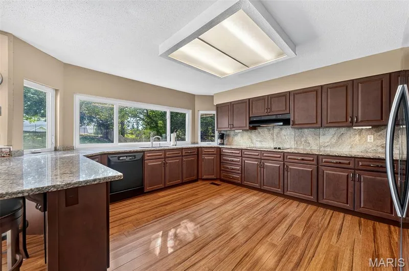 Large Kitchen With Backyard Views! Tons of Storage & Granite Countertops — 25 Vicksburg Station, St Charles, MO 63303