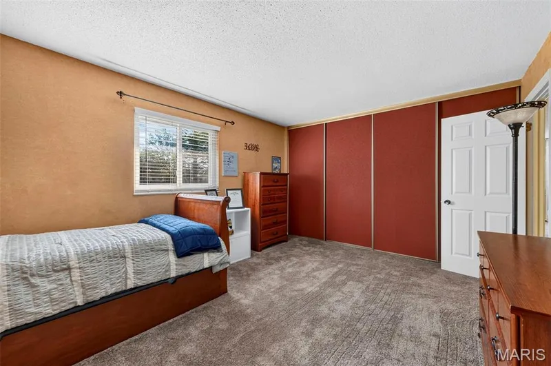Upper Bedroom 2 with wall of closets — 25 Vicksburg Station, St Charles, MO 63303