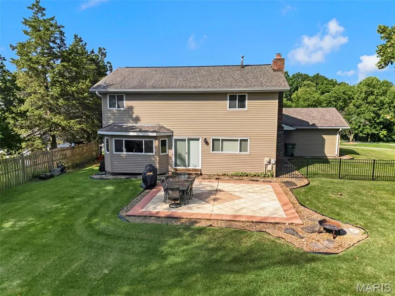 .54 acre lot. Ready to play with a custom patio & fully fenced! — 25 Vicksburg Station, St Charles, MO 63303